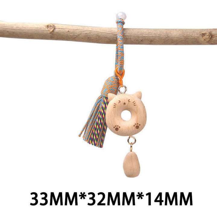 Buddha Stones Porte-clés porte-bonheur en bois clair sculpté à la main avec pompon chat, symbole d'ancrage - Chat à anneaux bleus - image 22