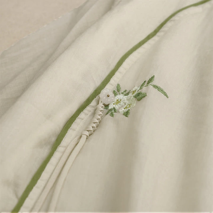 Chemise femme beige à manches trois-quarts, ornée de broderies florales et de feuilles vertes, avec motif de Buddha Stones - image 4