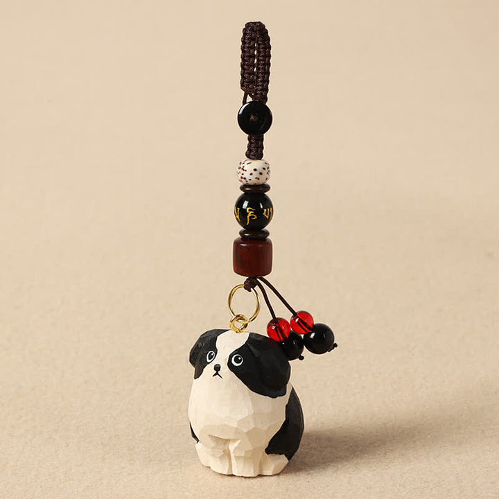 Buddha Stones Porte-clés en bois sculpté représentant un chien, symbole de sagesse Om Mani Padme Hum - Om Mani Padme Hum Chien noir et blanc - image 2