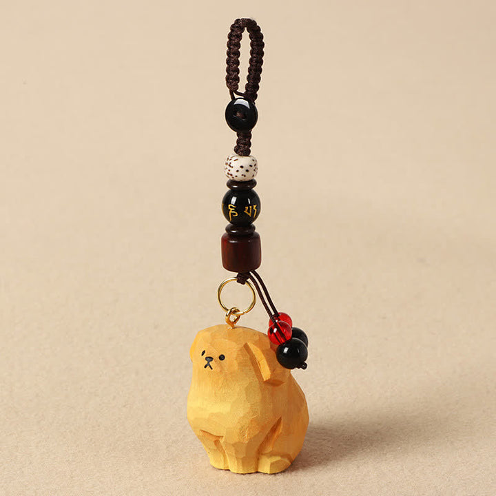 Buddha Stones Porte-clés en bois sculpté représentant un chien Om Mani Padme Hum et symbole de créativité - Om Mani Padme Hum Chien Jaune - image 3
