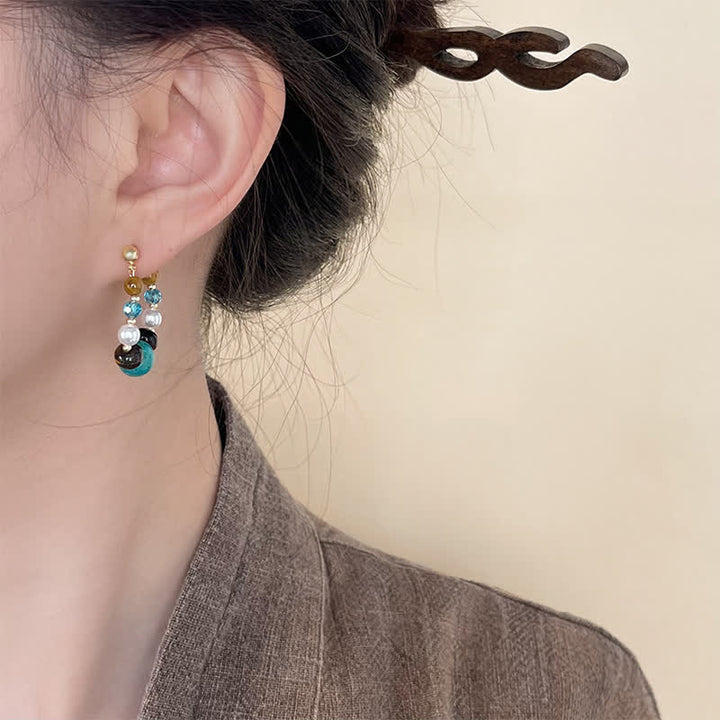 Buddha Stones Boucles d'oreilles de protection faites main en turquoise et perle œil de tigre - image 2