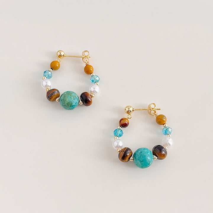 Buddha Stones Boucles d'oreilles de protection faites main en turquoise et perle œil de tigre - image 1