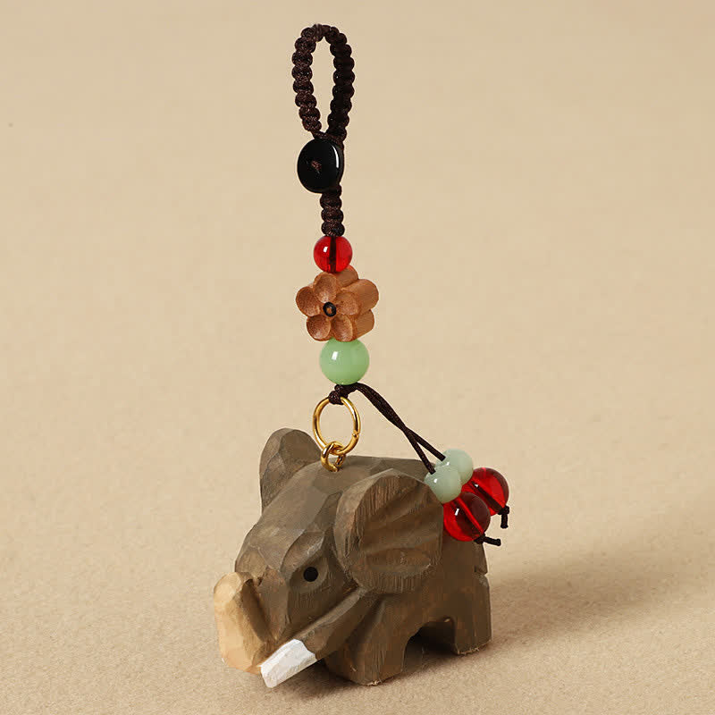 Buddha Stones Porte-clés Éléphant en bois naturel, symbole de paix, Om Mani Padme Hum et de pureté - Fleur de prunier éléphant - image 1
