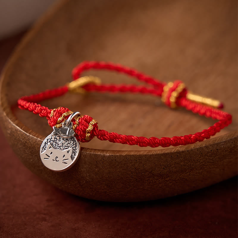 Buddha Stones Bracelet tressé rouge et noir en argent sterling 925 avec pendentif rond représentant un chaton mangeant du poisson, symbole de prospérité. - image 1