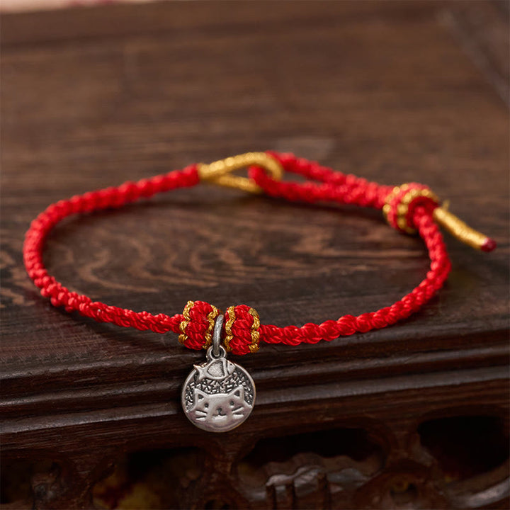 Buddha Stones Bracelet tressé rouge et noir en argent sterling 925 avec pendentif rond représentant un chaton mangeant du poisson, symbole de prospérité. - Rouge (Tour de poignet 14–18 cm) - image 0
