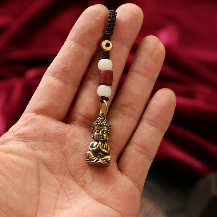Buddha Stones Porte-clés en laiton avec Bouddha, cinq pièces d'empereur et cordon tressé, symbole de compassion - image 2