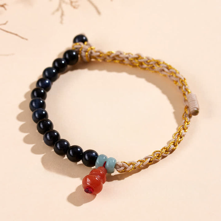 Buddha Stones Bracelet de force en calebasse tissée à la main avec œil de tigre bleu - image 1