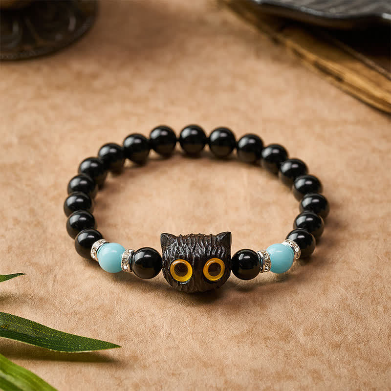 Buddha Stones Bracelet en obsidienne noire sculptée à la main avec perles en relief représentant un chat aux grands yeux - image 2