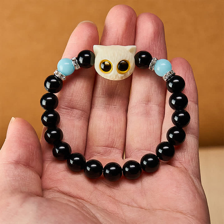 Buddha Stones Bracelet en obsidienne noire sculptée à la main avec perles en relief représentant un chat aux grands yeux - image 22