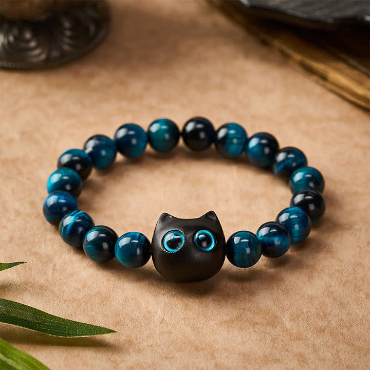 Buddha Stones Bracelet de force féline en bois d'ébène et œil de tigre bleu - image 1