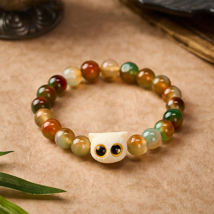 Buddha Stones Bracelet en agate paon, ivoire et fruit, symbole de courage et de chat - image 1