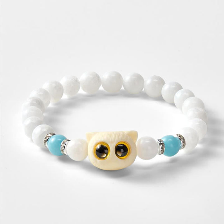 Buddha Stones Bracelet de pureté en perles d'obsidienne noire et de calcédoine blanche à tête de chat aux grands yeux - image 10