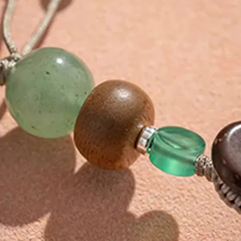 Buddha Stones Porte-clés perlés en cuivre avec sac de bénédiction tissé à la main représentant le personnage Fu - image 13