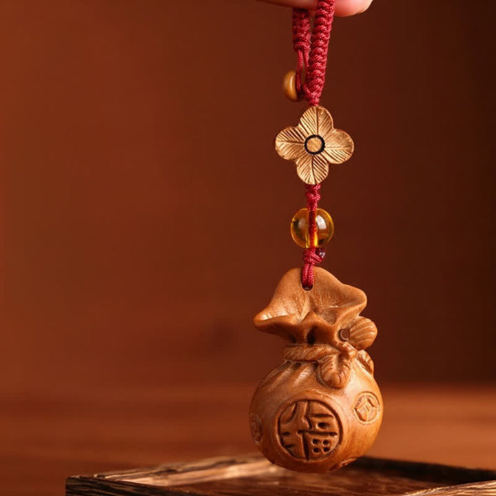 Buddha Stones Porte-clés porte-bonheur en bois de pêcher, motif lotus, avec pochette porte-bonheur - Corde rouge Fleur de prunier - image 1