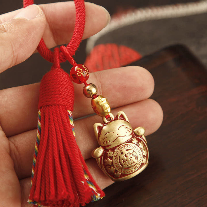 Buddha Stones Porte-clés pompon de bénédiction en laiton tressé à la main avec ficelle rouge représentant le personnage Fu - Chat porte-bonheur à pompon rouge - image 0