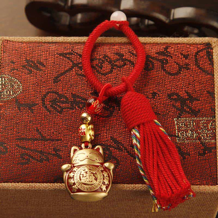 Buddha Stones Porte-clés pompon de bénédiction en laiton tressé à la main avec ficelle rouge représentant le personnage Fu - image 1
