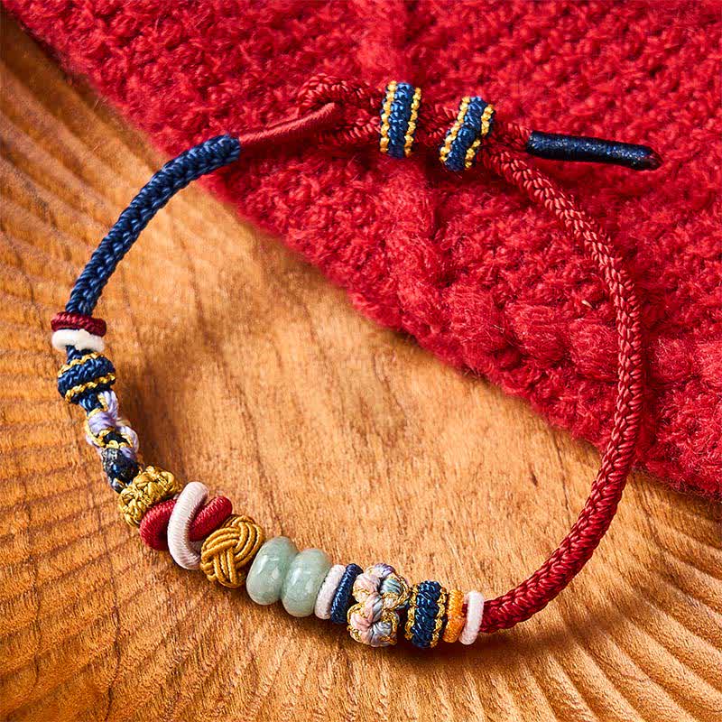Buddha Stones Bracelet en cordon rouge et bleu marine avec perles de jade porte-bonheur en forme de fleur de pêcher tissées à la main - image 1