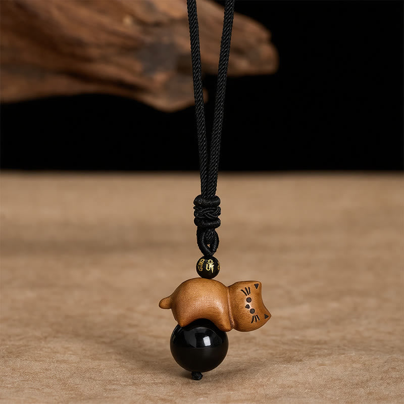 Buddha Stones Collier de protection en corde avec perle Om Mani Padme Hum et perle en obsidienne noire et bois de santal, orné d'un chat et d'une perle Om Mani Padme Hum. - Bois de santal et obsidienne noire - image 0