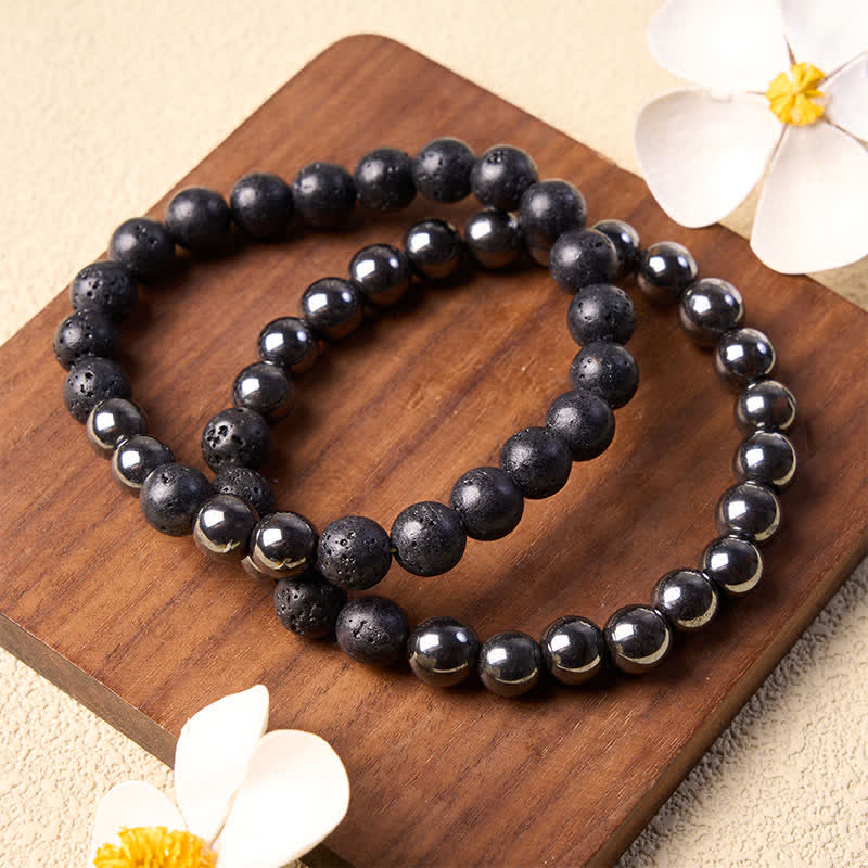 Buddha Stones Bracelet minimaliste en perles d'hématite et de lave, symbole d'ancrage - image 1