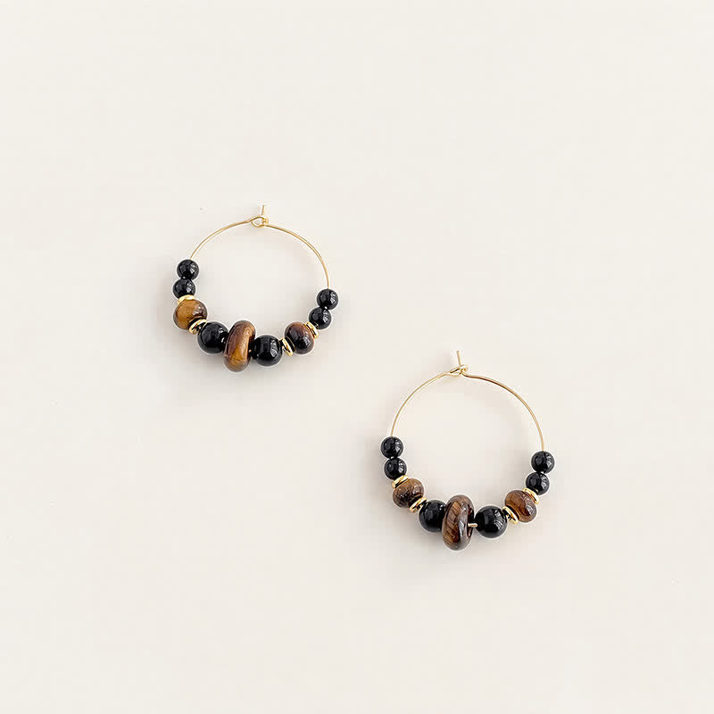 Buddha Stones Boucles d'oreilles créoles de protection en œil de tigre et onyx noir - image 1