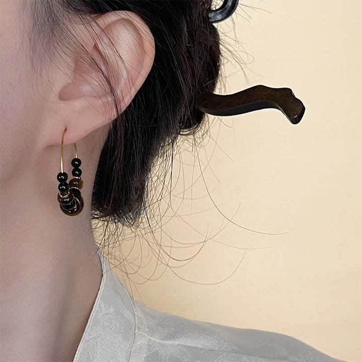 Buddha Stones Boucles d'oreilles créoles de protection en œil de tigre et onyx noir - image 3