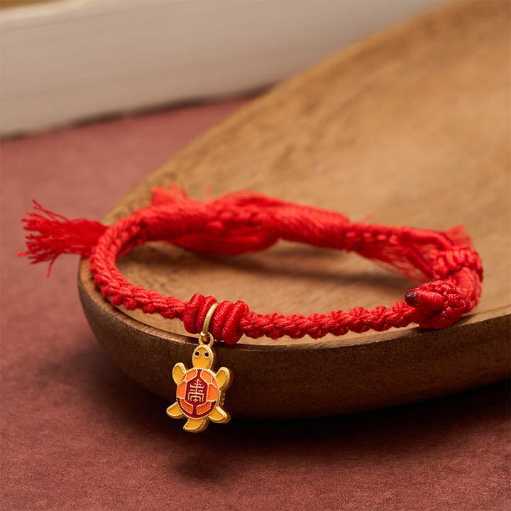 Buddha Stones Bracelet tibétain en cuivre plaqué or avec breloque tortue et cordon rouge - image 1