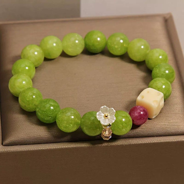 Buddha Stones Bracelet de perles de guérison avec breloque fleur de péridot - image 1