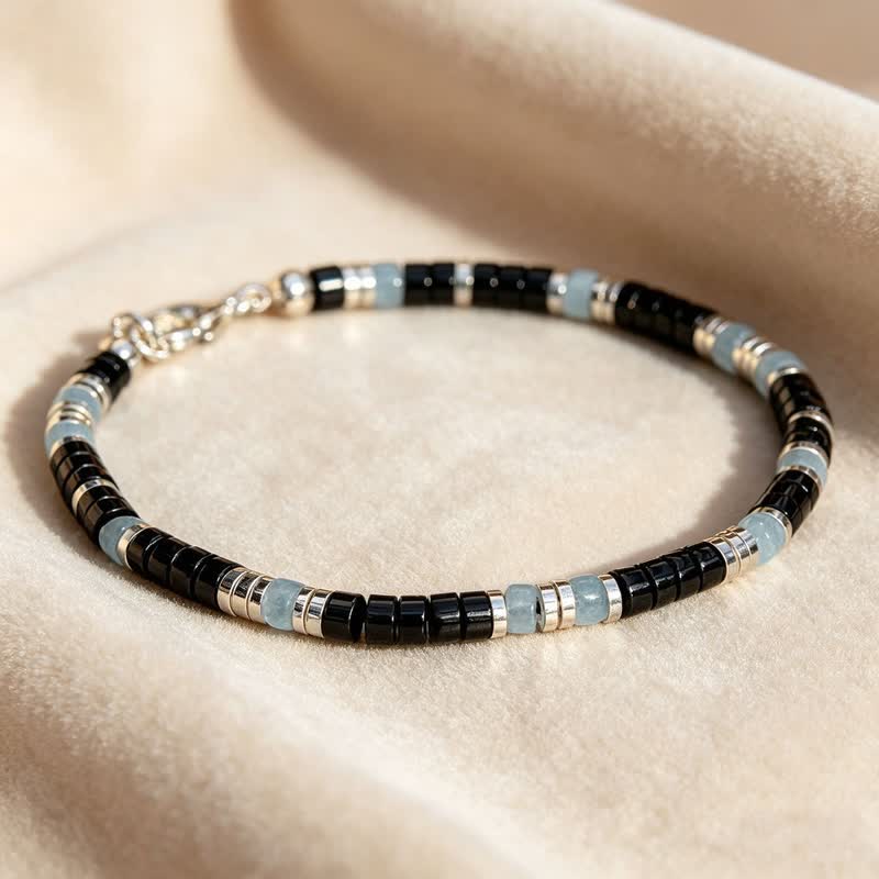 Buddha Stones Bracelet extensible de protection en perles d'onyx noir et de calcédoine bleue - image 1