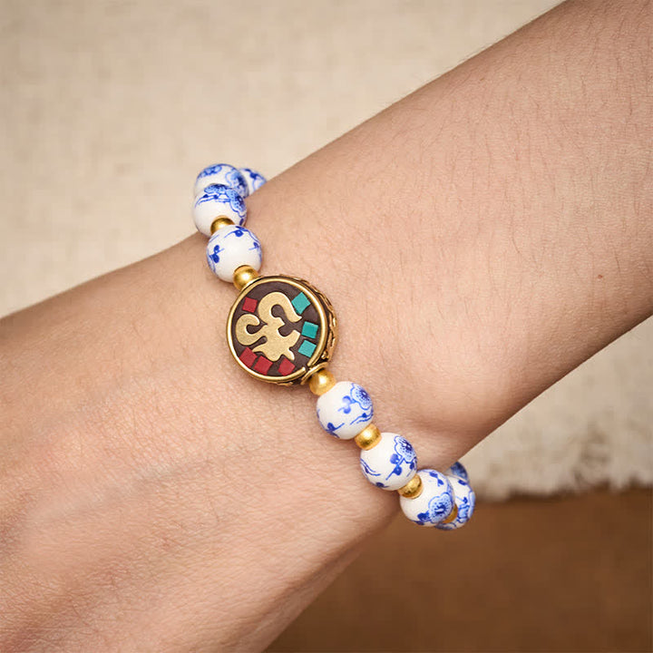Buddha Stones Bracelet de perles de compassion OM en porcelaine bleue et blanche et cuivre - image 3