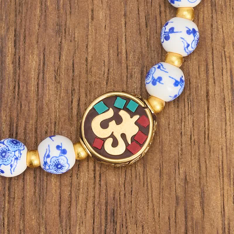 Buddha Stones Bracelet de perles de compassion OM en porcelaine bleue et blanche et cuivre - image 4