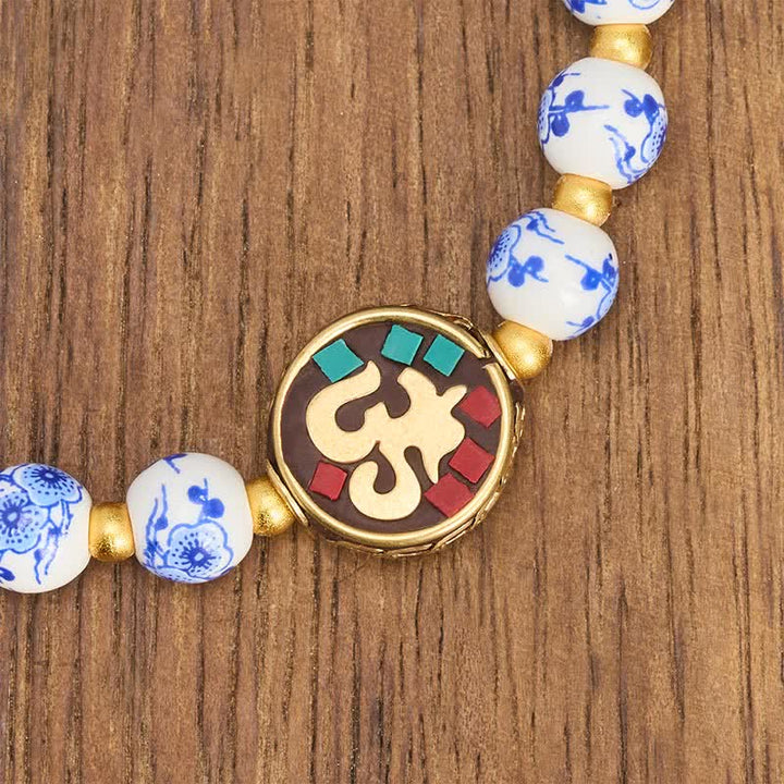Buddha Stones Bracelet de perles de compassion OM en porcelaine bleue et blanche et cuivre - image 4