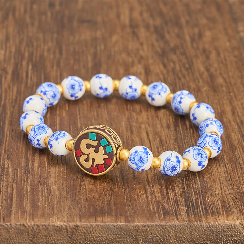 Buddha Stones Bracelet de perles de compassion OM en porcelaine bleue et blanche et cuivre - image 1