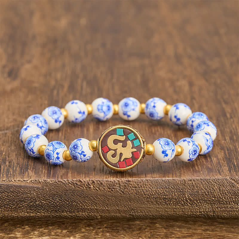 Buddha Stones Bracelet de perles de compassion OM en porcelaine bleue et blanche et cuivre - OM (Pleine conscience ♥ Connexion) - image 0