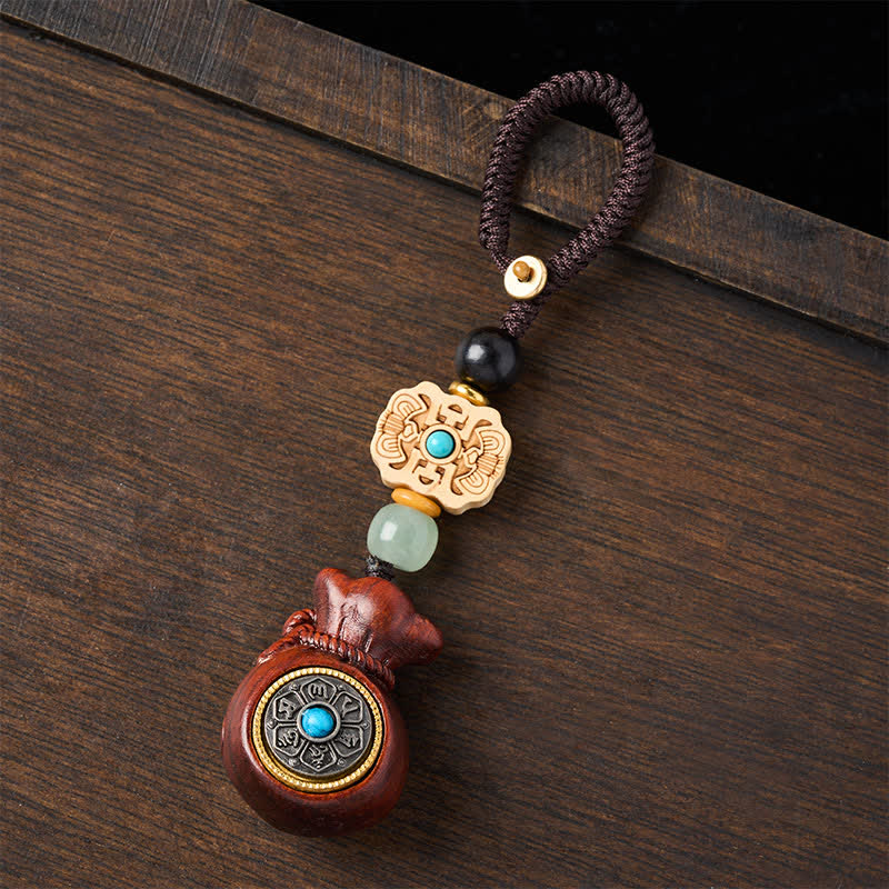 Buddha Stones Porte-clés Sérénité en bois de santal rouge et vert, symbole de bénédiction Om Mani Padme Hum, avec pièces de monnaie chinoises. - image 1