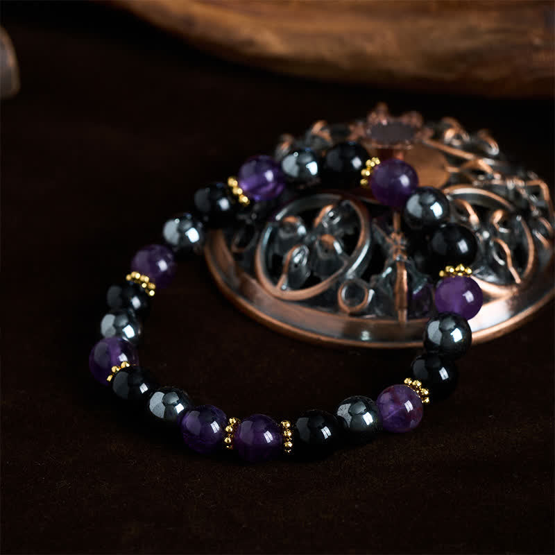 Buddha Stones Bracelet de méditation en perles d'améthyste, d'obsidienne noire et d'hématite - image 1