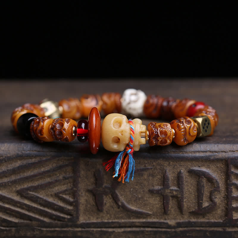 Buddha Stones Bracelet tibétain en perles d'os sculptées à la main, représentant le Seigneur de la Forêt des Cadavres, symbole de protection. - image 1