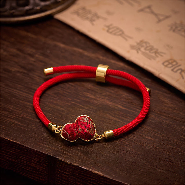 Buddha Stones Bracelet de protection en brocart de gourde Red String Song - Brocart Song (Même ton de couleur – motif variable) - image 0
