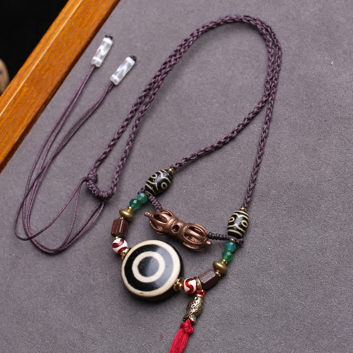Buddha Stones Collier de protection en perles Dzi tibétaines Vajra à trois yeux et corde tressée - Environ 24 × 10 mm - image 0