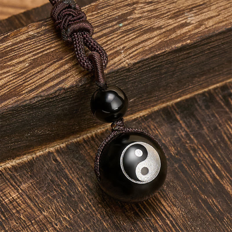 Buddha Stones Pendentif Yin Yang de purification en obsidienne noire sculptée, symbole de purification. - image 1