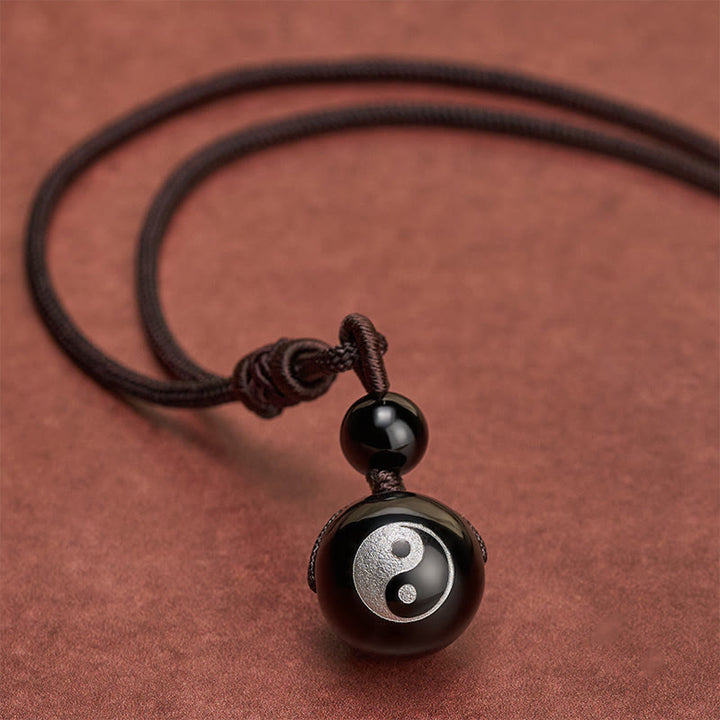Buddha Stones Pendentif Yin Yang de purification en obsidienne noire sculptée, symbole de purification. - image 2