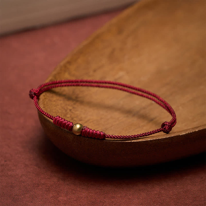 Buddha Stones Bracelet à perles de cuivre et fil rouge - image 1