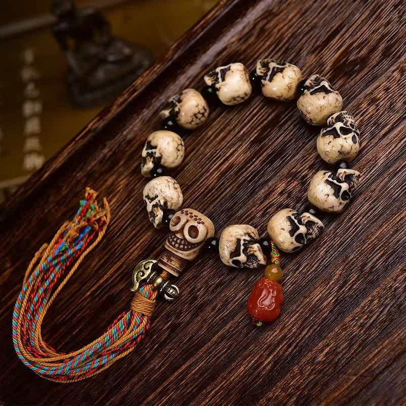 Buddha Stones Bracelet de protection tibétain en perles d'os sculptées à la main, motif Seigneur de la Forêt des Cadavres - 22 × 14 × 13 mm - image 0