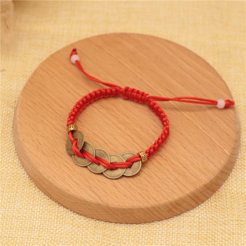 Bracelet tissé en fil rouge avec pièces de cuivre et Buddha Stones