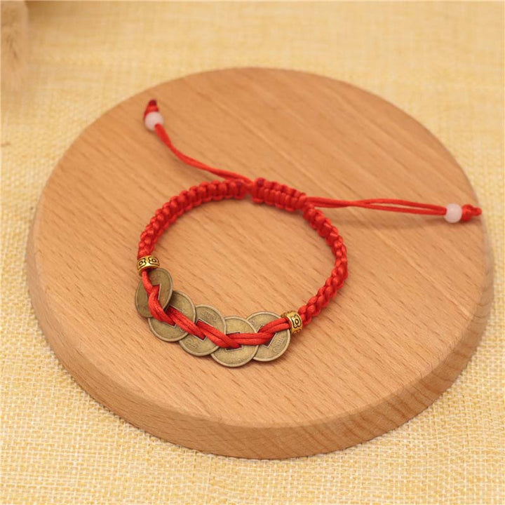 Bracelet tissé en fil rouge avec pièces de cuivre et Buddha Stones