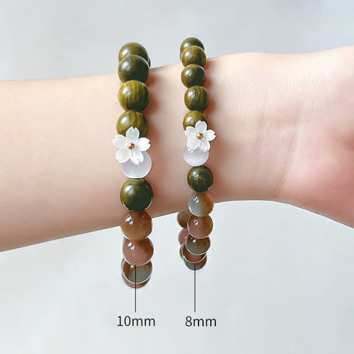 Buddha Stones Bracelet Sérénité avec breloque fleur œil-de-chat en bois de santal vert - image 10
