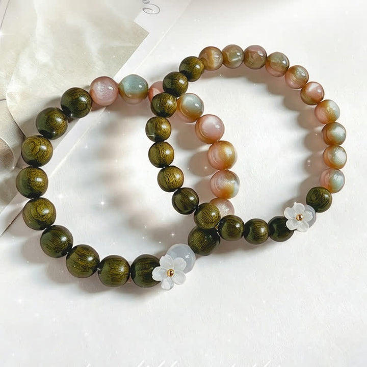 Buddha Stones Bracelet Sérénité avec breloque fleur œil-de-chat en bois de santal vert - image 11