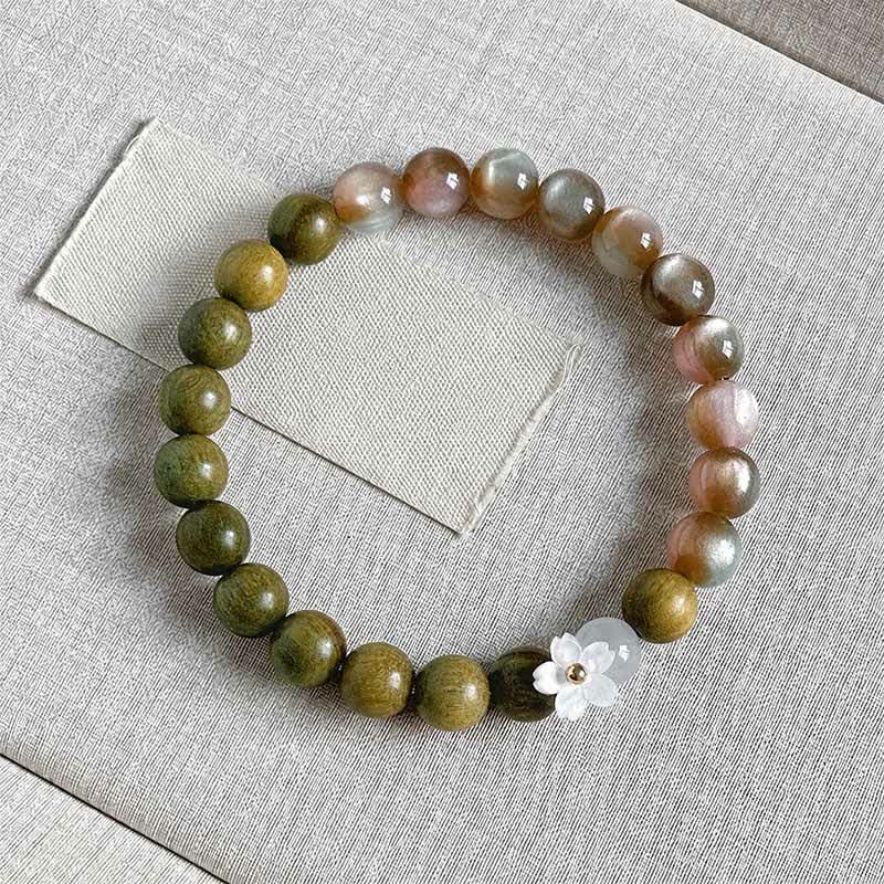 Buddha Stones Bracelet Sérénité avec breloque fleur œil-de-chat en bois de santal vert - Perles roses de 8 mm - image 0