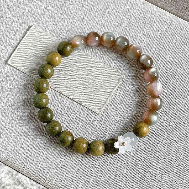 Buddha Stones Bracelet Sérénité avec breloque fleur œil-de-chat en bois de santal vert - Perles roses de 8 mm - image 0