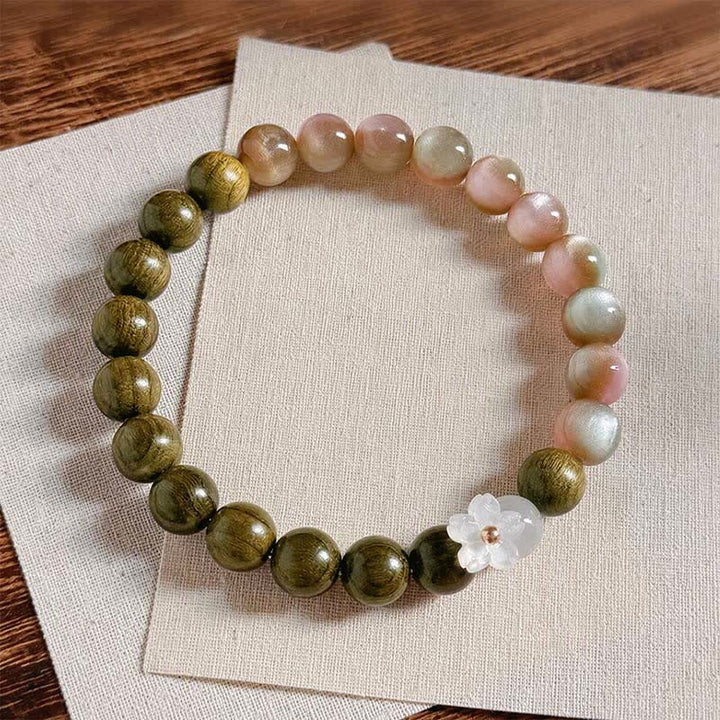 Buddha Stones Bracelet Sérénité avec breloque fleur œil-de-chat en bois de santal vert - image 1