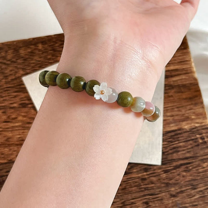 Buddha Stones Bracelet Sérénité avec breloque fleur œil-de-chat en bois de santal vert - image 4